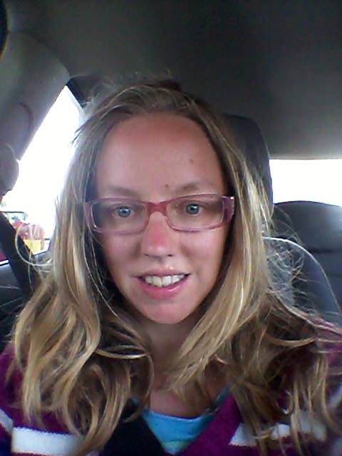 Elin sits in a car somewhere in Great Britain in the summer of 2014
