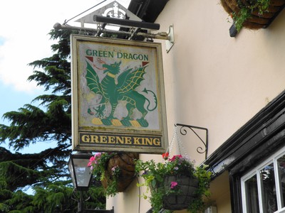 Skylten till Puben The Greene King längs floden Cam i Cambridge