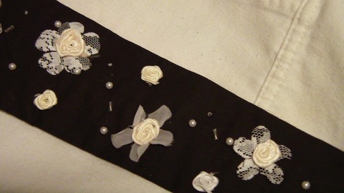 Necktie decorated with beads and satin roses.